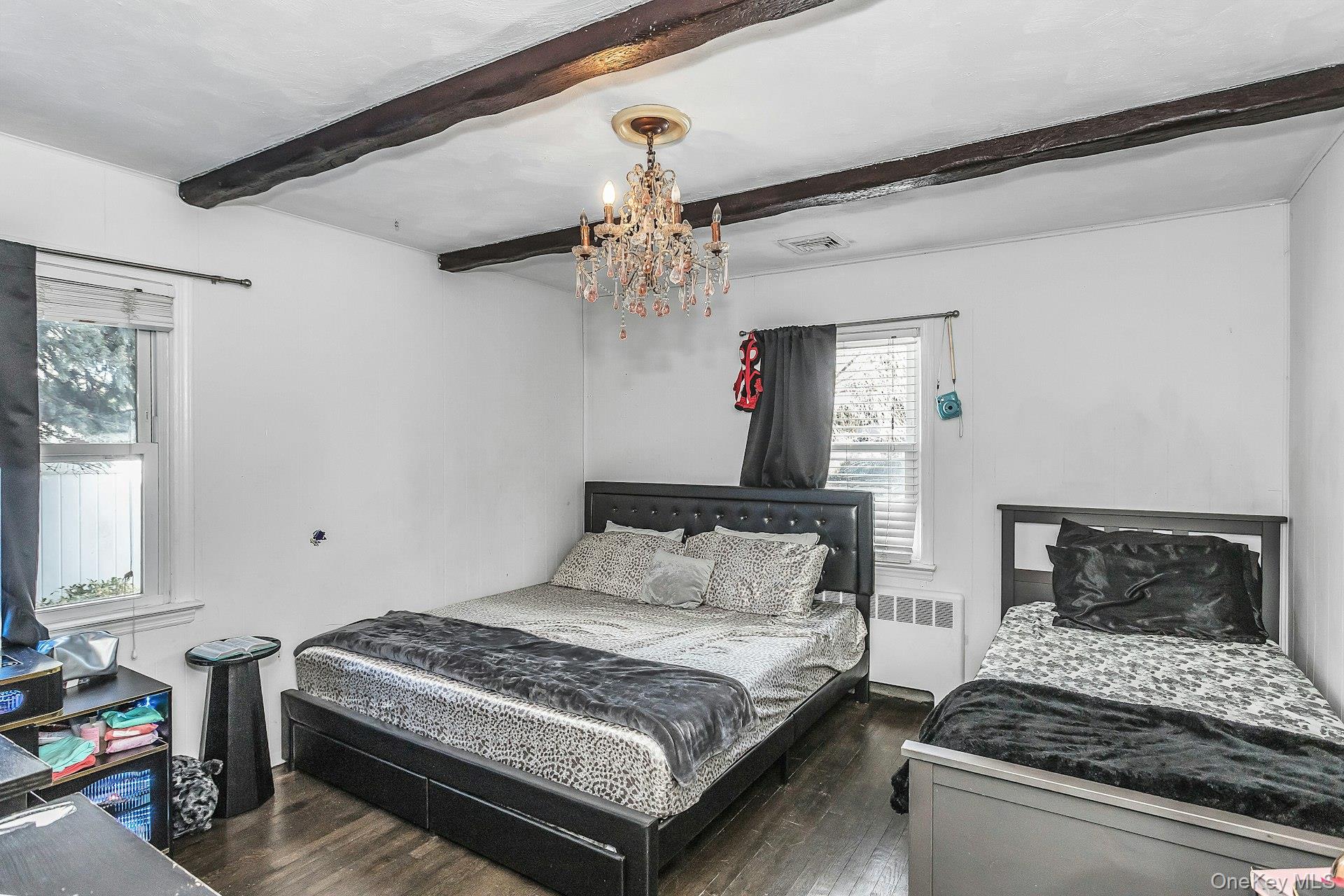 3348 3rd Street Oceanside, NY 11572 - Photo 13 of 32 a bedroom with a bed and window
