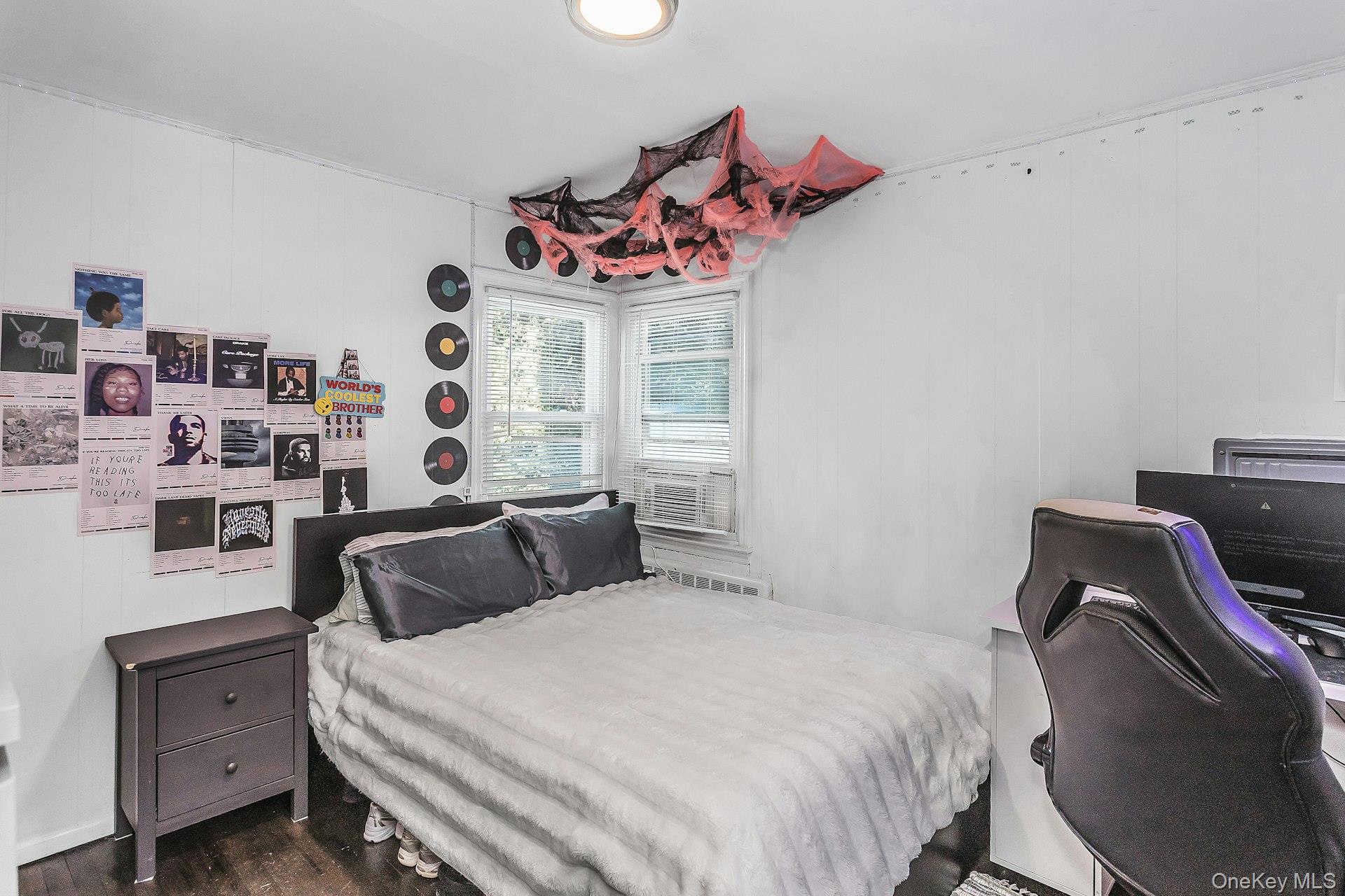 3348 3rd Street Oceanside, NY 11572 - Photo 14 of 32 a bedroom with a bed and a dresser