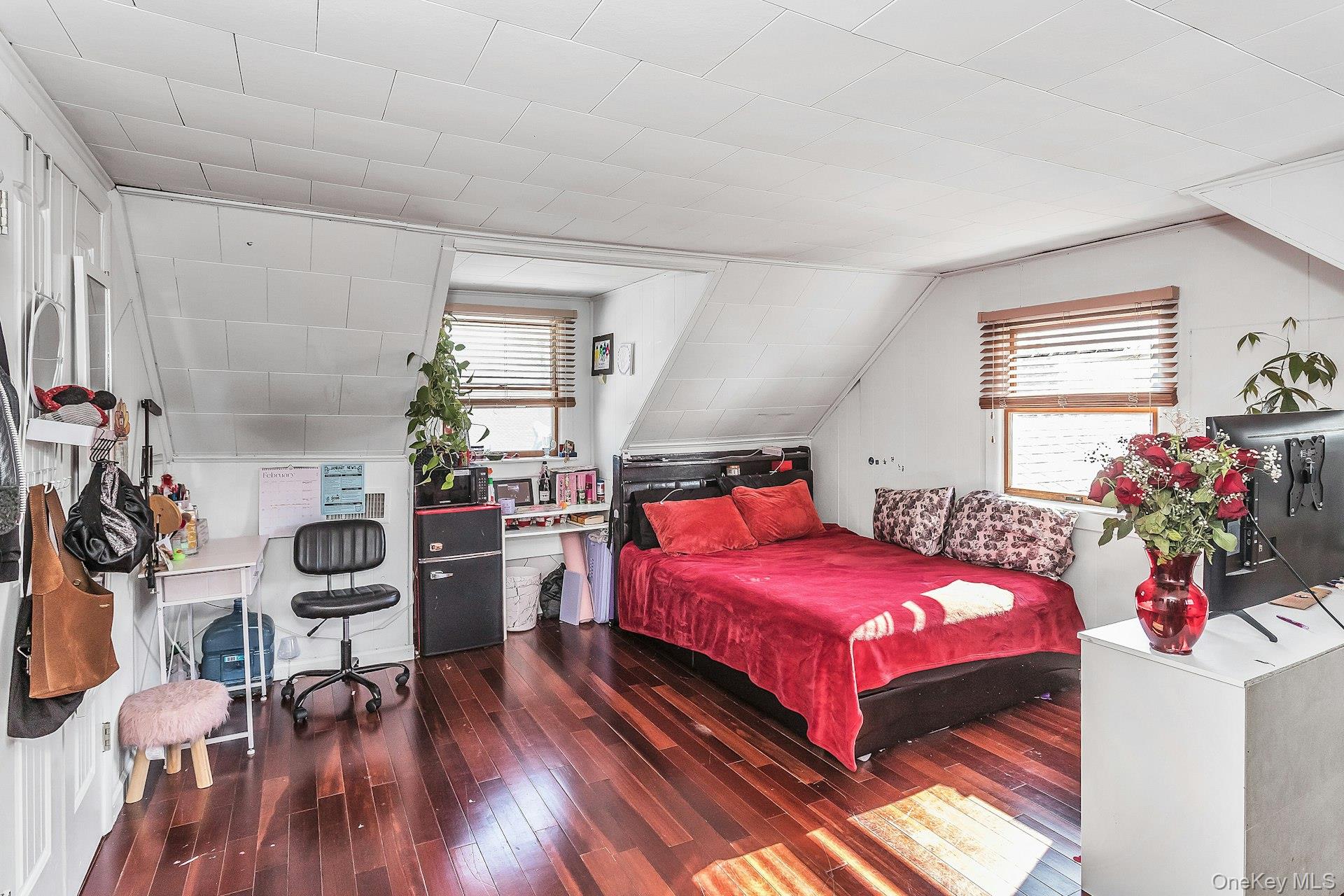 3348 3rd Street Oceanside, NY 11572 - Photo 18 of 32 a bedroom with a bed and a wooden floor