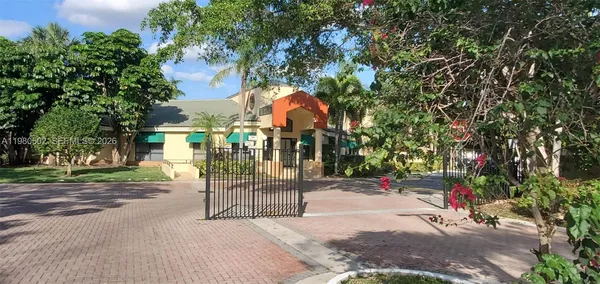a view of a house with swimming pool and sitting area