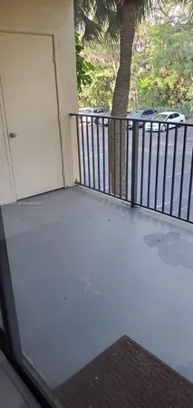 a view of balcony with wooden floor