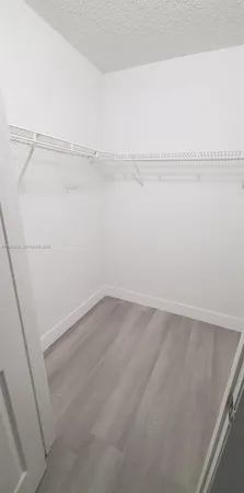a view of an empty walk in closet