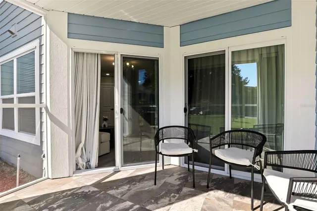 a view of a garden with large trees