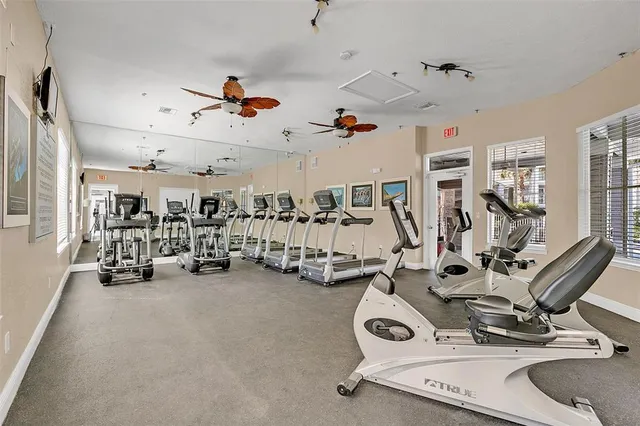 a view of a house with swimming pool and sitting area