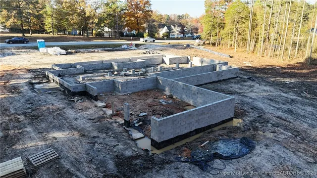 a view of a swimming pool with lawn chairs under an umbrella