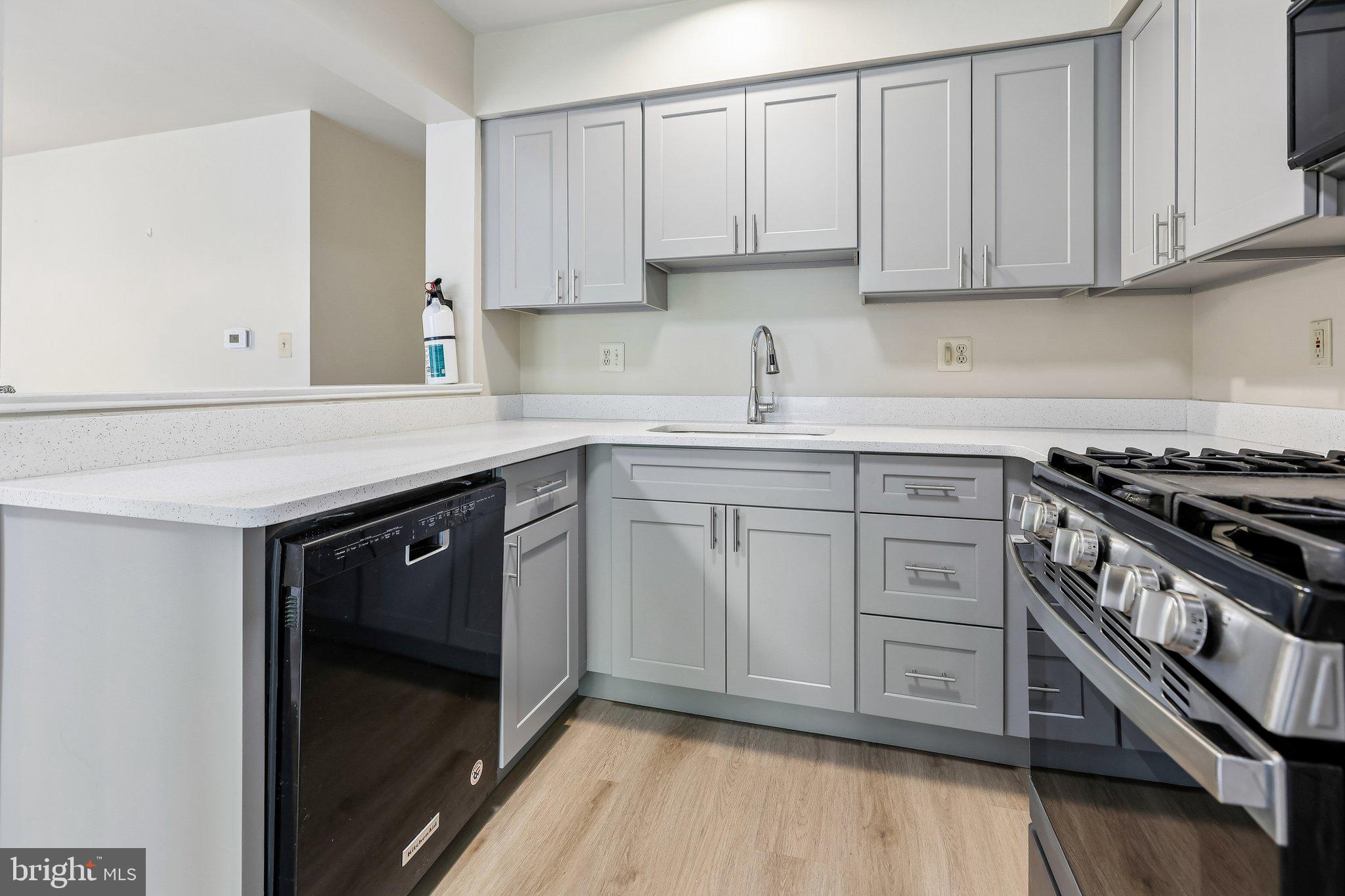 624 Brickhouse Road Princeton, NJ 08540 - Photo 18 of 43 a kitchen with a sink stove and cabinets