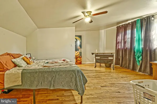 a bed sitting in a room next to a window