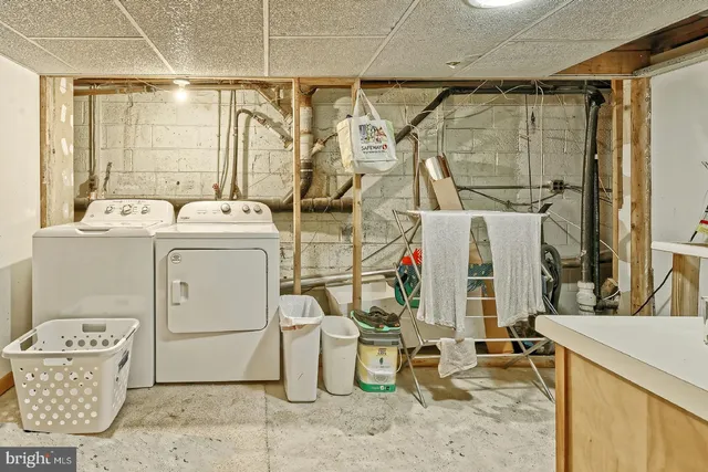 a room with filled with furniture and large windows