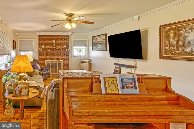 a living room with furniture and flat screen tv