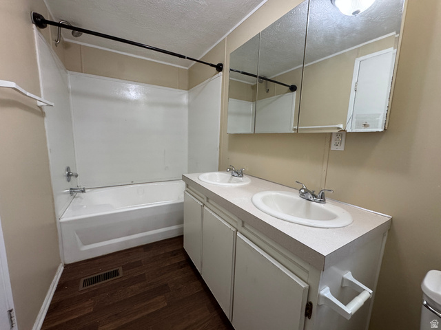 2491 Highway 89, Unit 315 Pleasant View, UT 84404 - Photo 15 of 34 Bathroom featuring a double vanity with integrated sinks and a medicine cabinet with mirrored fronts