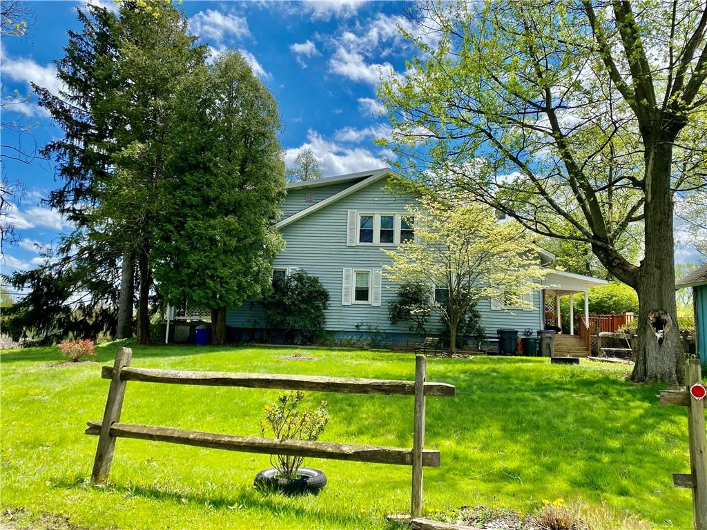 2410 Willowbrook Road Pittsburgh, PA 15241 - Photo 6 of 23 a view of a house with a big yard and palm trees