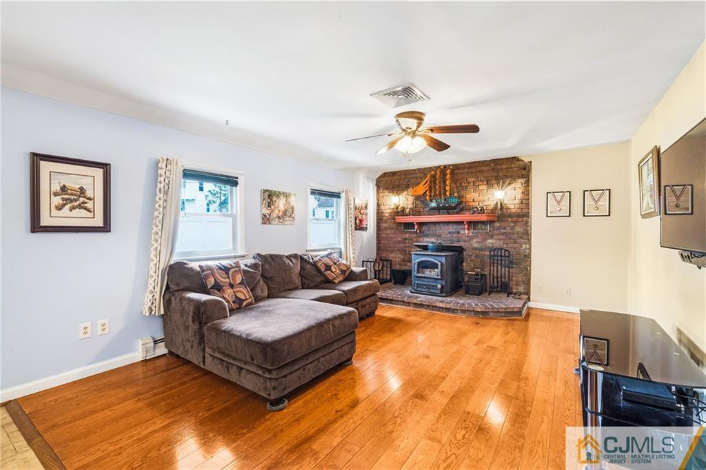 151 East Cliff Road Colonia, NJ 07067 - Photo 13 of 29 a living room with furniture and a fireplace