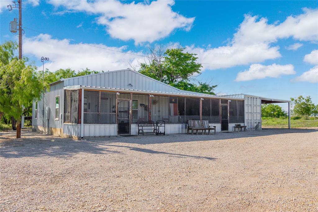970 County Road 256 Coleman, TX 76834 - Photo 26 of 35 a backyard of a house with table and chairs