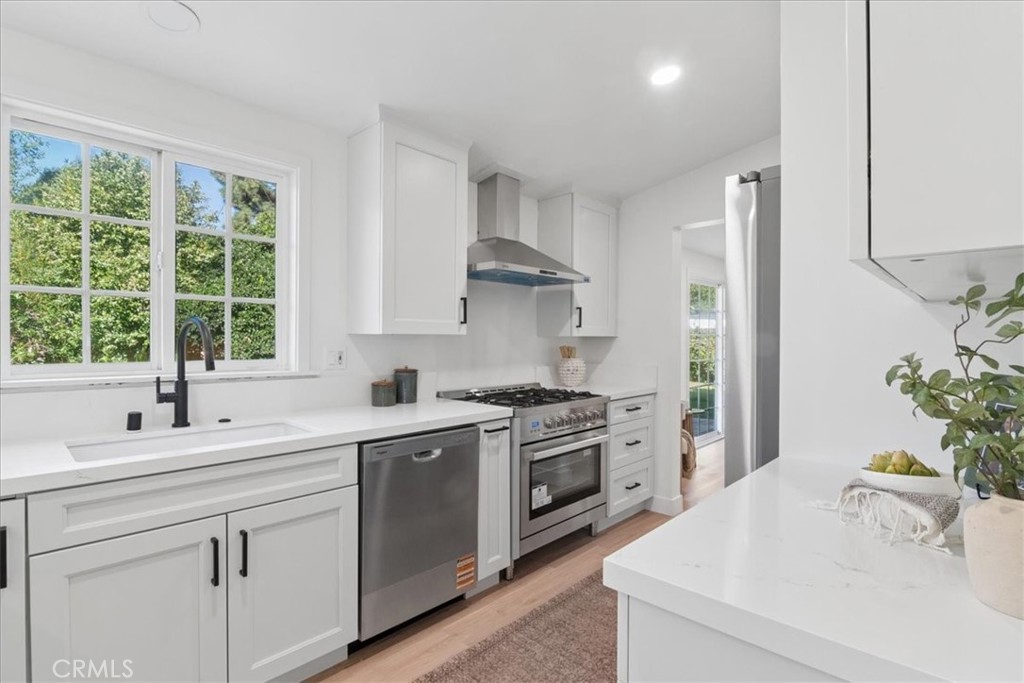 3093 Fish Canyon Road Duarte, CA 91010 - Photo 14 of 27 a kitchen that has a sink and a stove