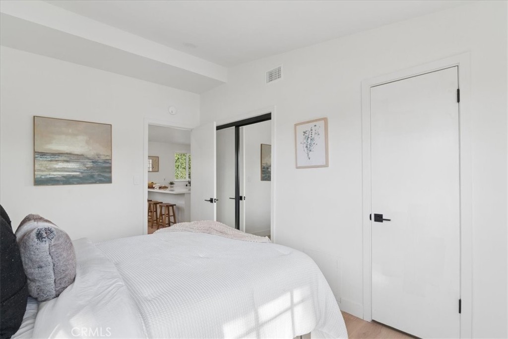 3093 Fish Canyon Road Duarte, CA 91010 - Photo 17 of 27 a bedroom with a bed and a window