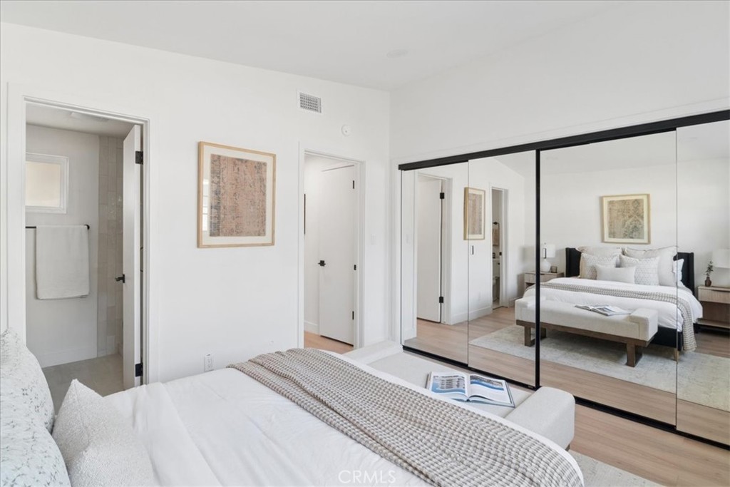 3093 Fish Canyon Road Duarte, CA 91010 - Photo 21 of 27 a spacious bedroom with a bed and wooden floor