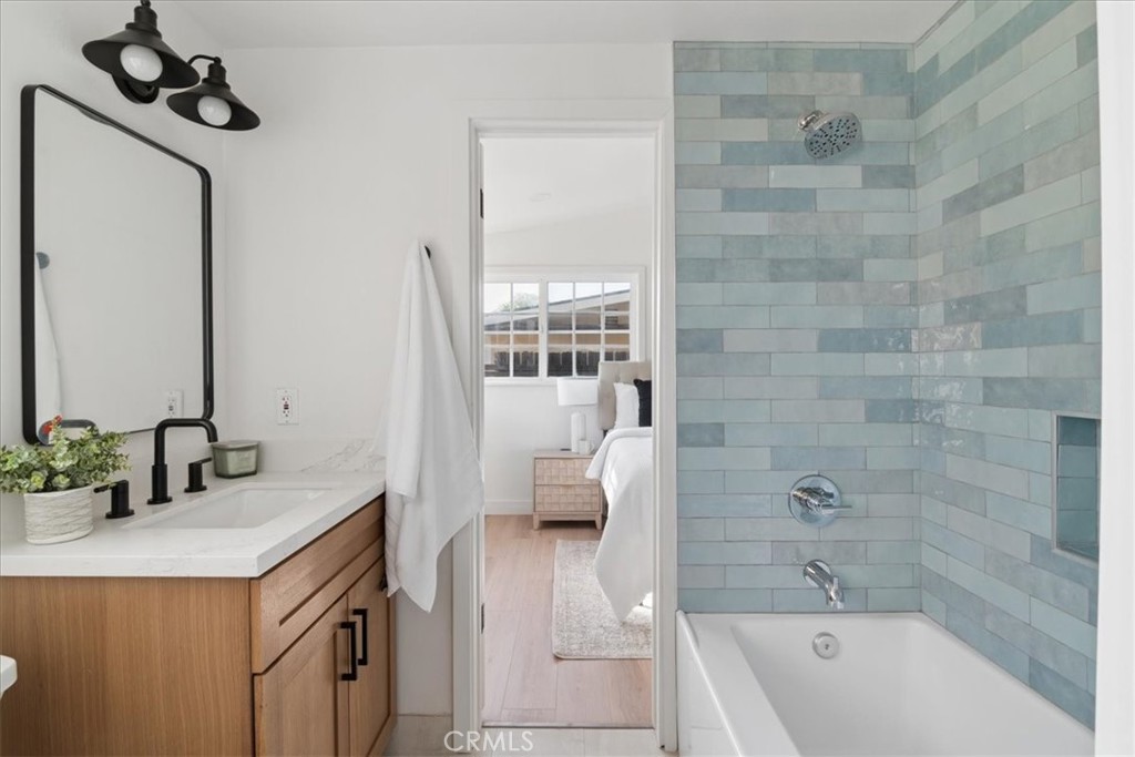 3093 Fish Canyon Road Duarte, CA 91010 - Photo 4 of 27 a bathroom with a tub sink and mirror