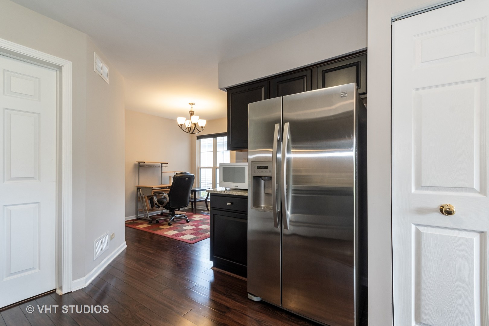 1234 Coldspring Road Elgin, IL 60120 - Photo 3 of 15 a kitchen with a refrigerator and a stove top oven