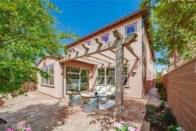 216 Midvale Irvine, CA 92620 - Photo 2 of 9 a backyard of a house with outdoor seating