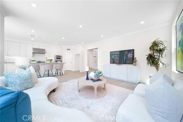 216 Midvale Irvine, CA 92620 - Photo 3 of 9 a living room with furniture and a potted plant