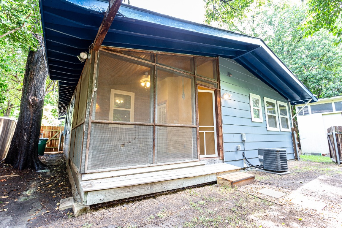 a view of house with backyard and outdoor seating