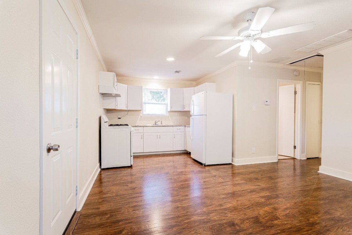 1909 Morrow Street, Unit B Austin, TX 78757 - Photo 5 of 16 a view of a kitchen with wooden floor and a window