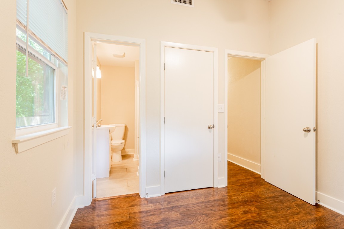 1909 Morrow Street, Unit B Austin, TX 78757 - Photo 8 of 16 a view of a bathroom with a glass door