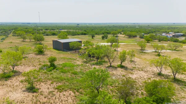 a house with pool in front of it