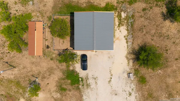a brick building with a tree in front of it