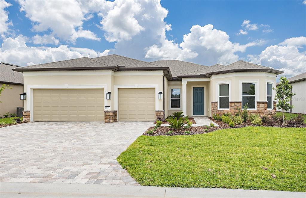 8734 Southwest 55th St Road Ocala, FL 34481 - Photo 1 of 1 a front view of a house with garden