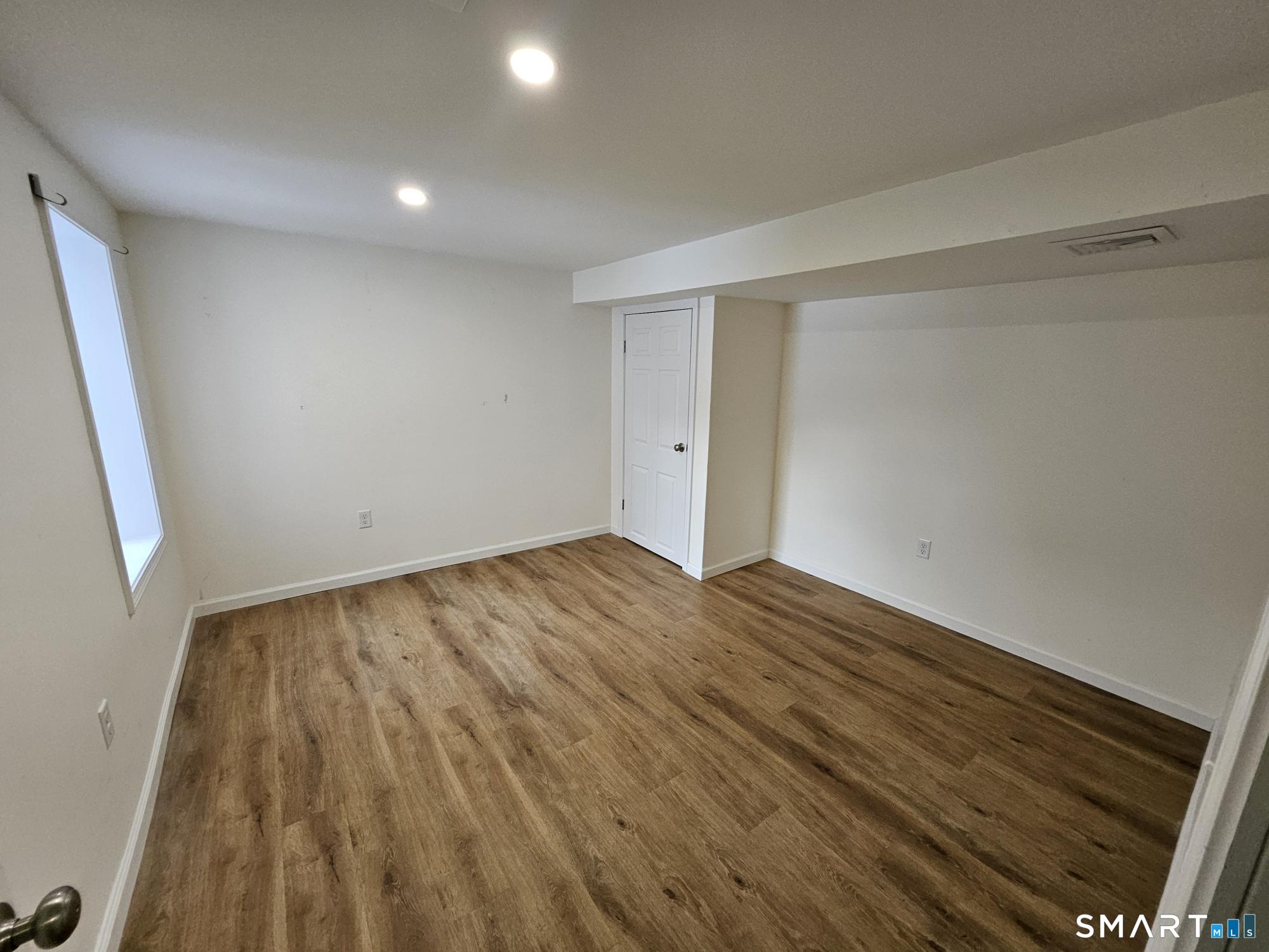 410 Main Street Southington, CT 06489 - Photo 2 of 7 a view of empty room with wooden floor