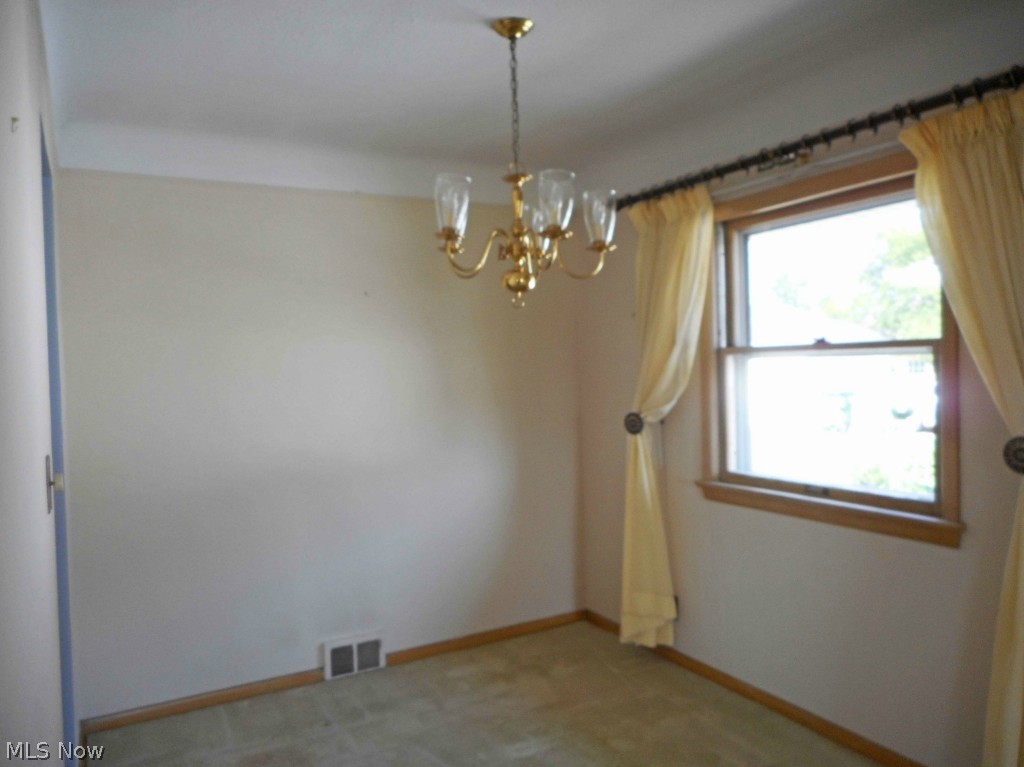 12311 Orme Road Garfield Heights, OH 44125 - Photo 3 of 12 Dining Room with Carpet over Wood Floor.
