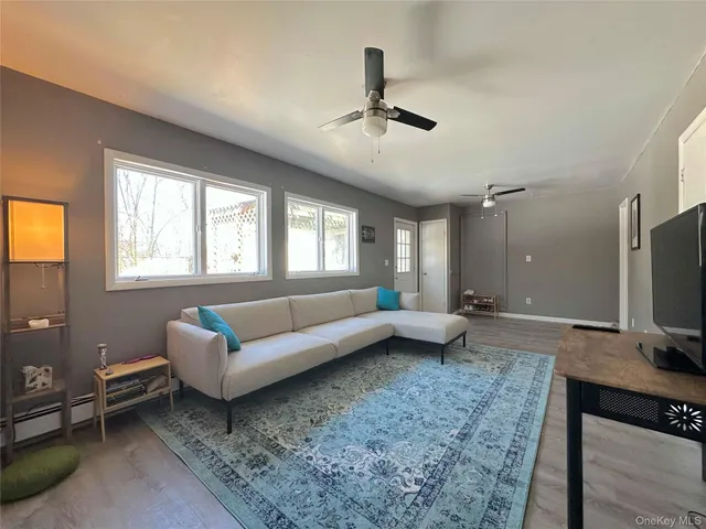 a spacious bedroom with a bed and a window