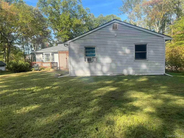 a view of a backyard with large trees