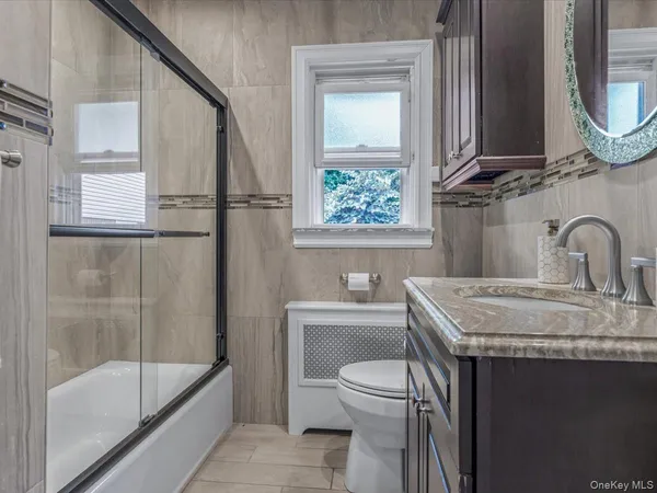 a bathroom with a sink a toilet and a bathtub