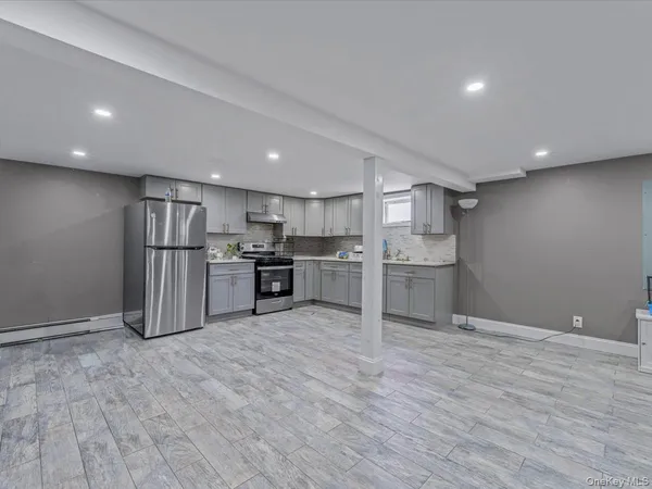 a kitchen with stainless steel appliances granite countertop a refrigerator sink and cabinets