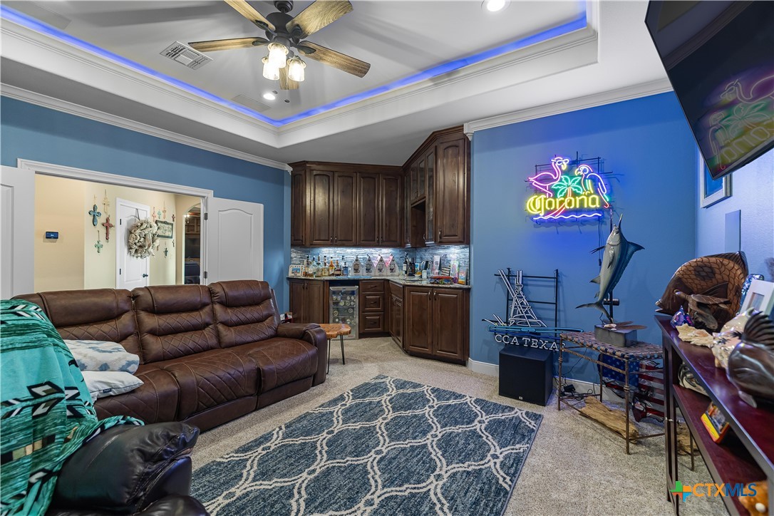 254 Sendera Loop Victoria, TX 77904 - Photo 26 of 48 a living room with furniture and a flat screen tv