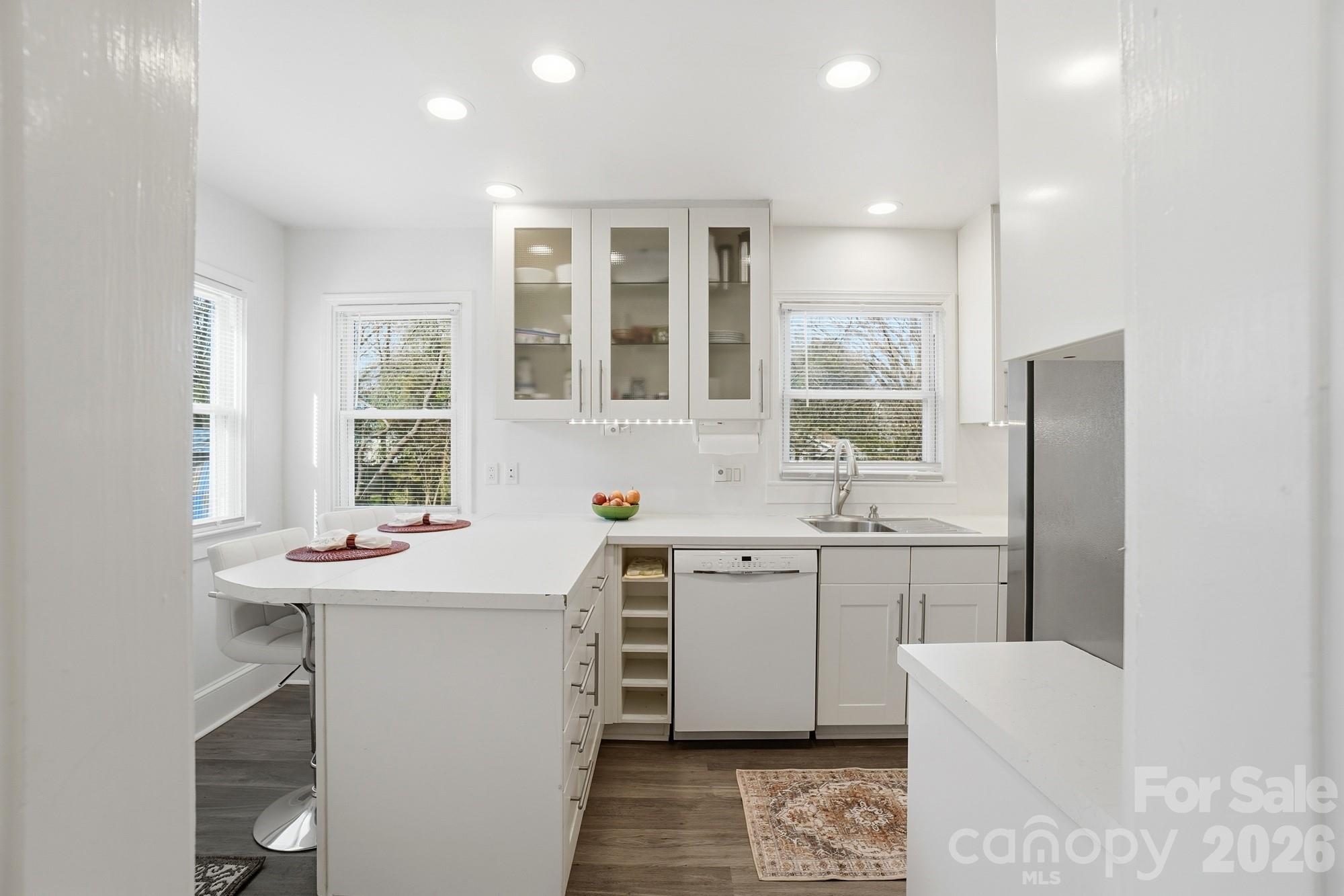 406 North Thompson Street Monroe, NC 28112 - Photo 11 of 24 a kitchen with sink stove and refrigerator