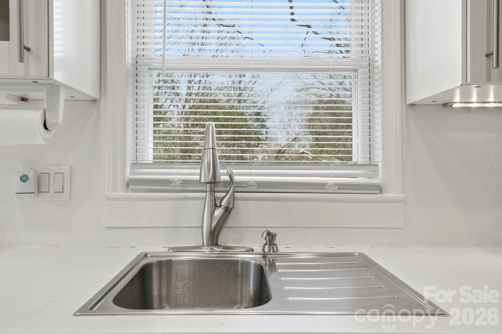 406 North Thompson Street Monroe, NC 28112 - Photo 13 of 24 a close view of a sink and a window