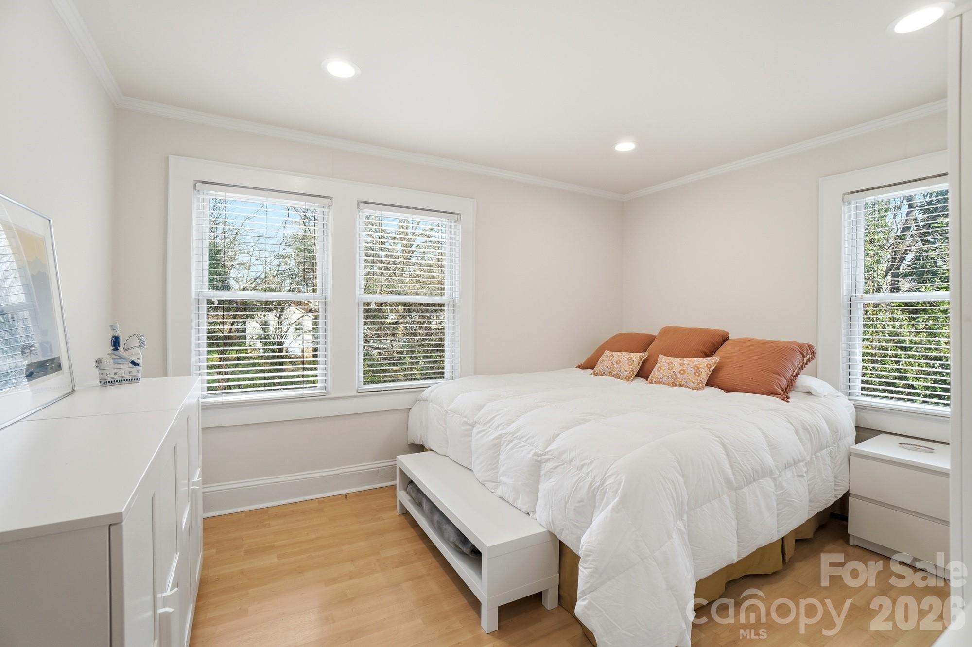 406 North Thompson Street Monroe, NC 28112 - Photo 16 of 24 a bedroom with a bed and a window