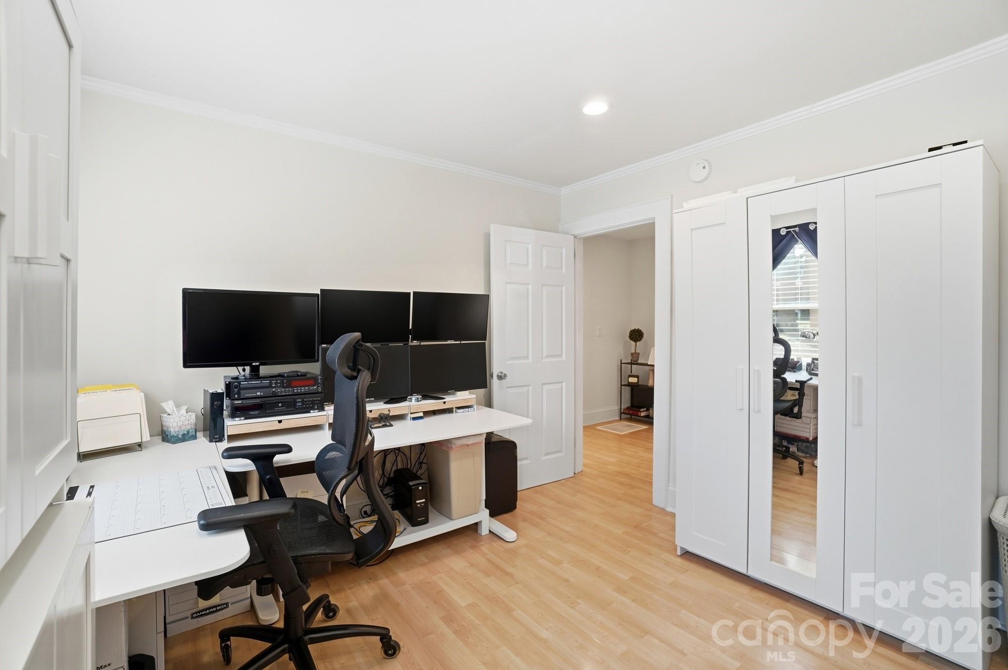 406 North Thompson Street Monroe, NC 28112 - Photo 20 of 24 a view of a livingroom with workspace and a window