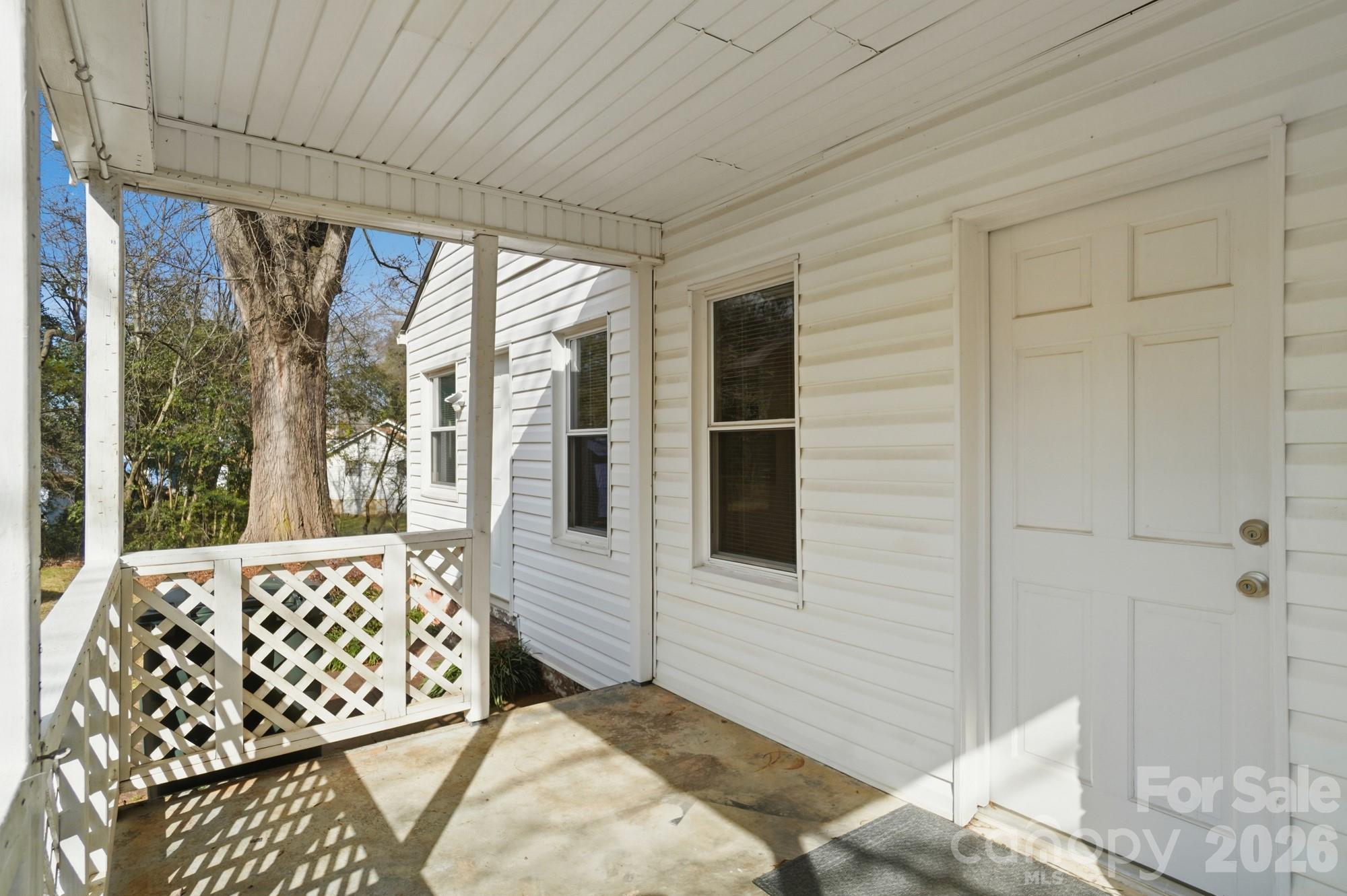 406 North Thompson Street Monroe, NC 28112 - Photo 21 of 24 a bedroom with a bed and wooden floor