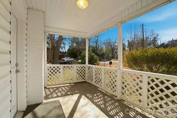 a view of a balcony with wooden floor