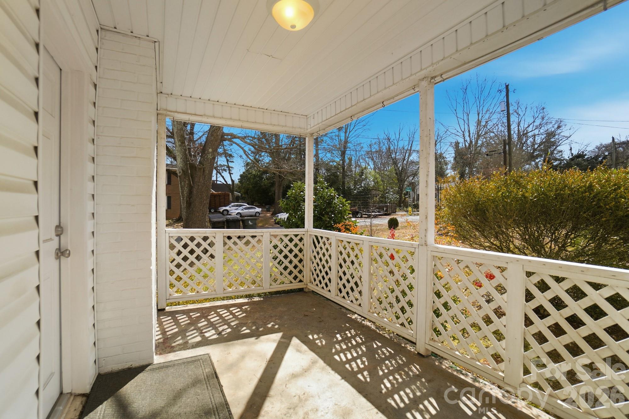 406 North Thompson Street Monroe, NC 28112 - Photo 22 of 24 a view of a balcony with wooden floor
