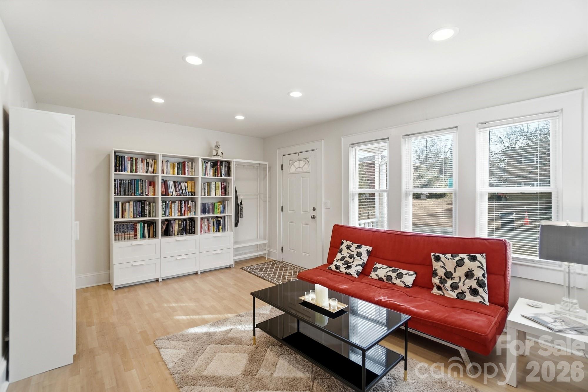 406 North Thompson Street Monroe, NC 28112 - Photo 6 of 24 a living room with furniture and windows