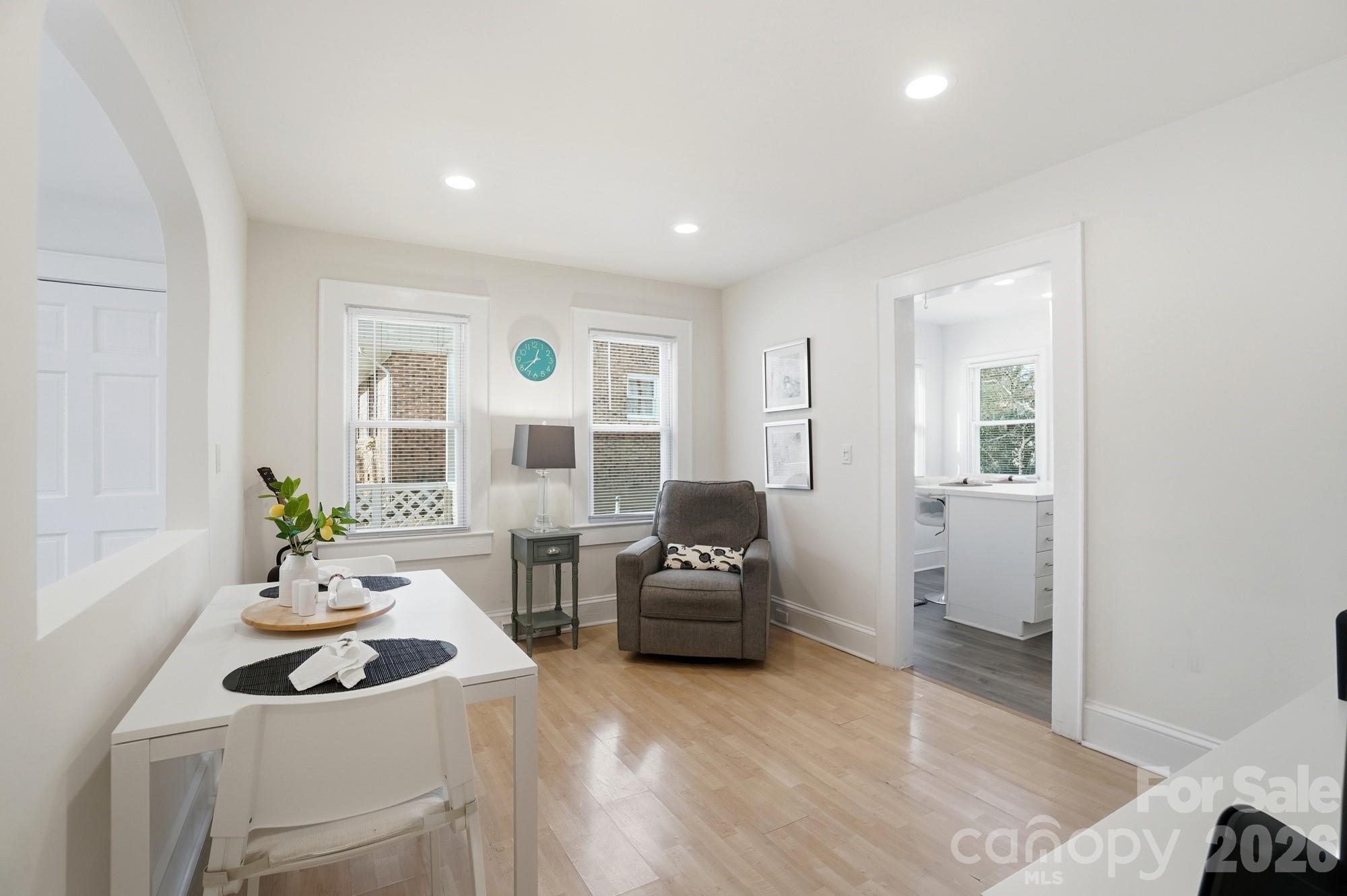 406 North Thompson Street Monroe, NC 28112 - Photo 8 of 24 a living room with furniture and a large window