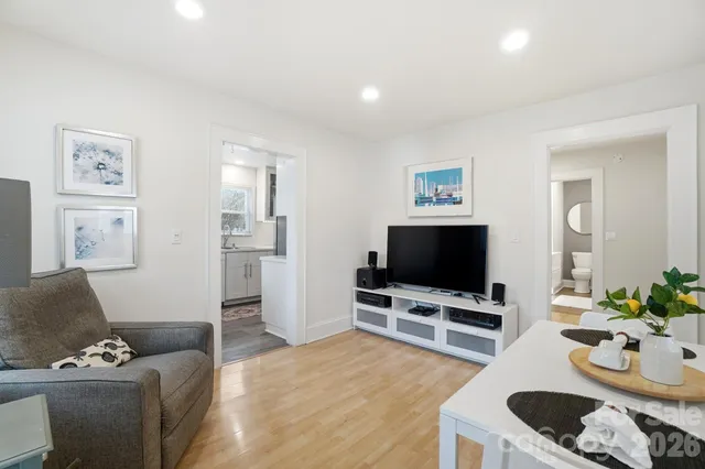 a living room with furniture and a flat screen tv