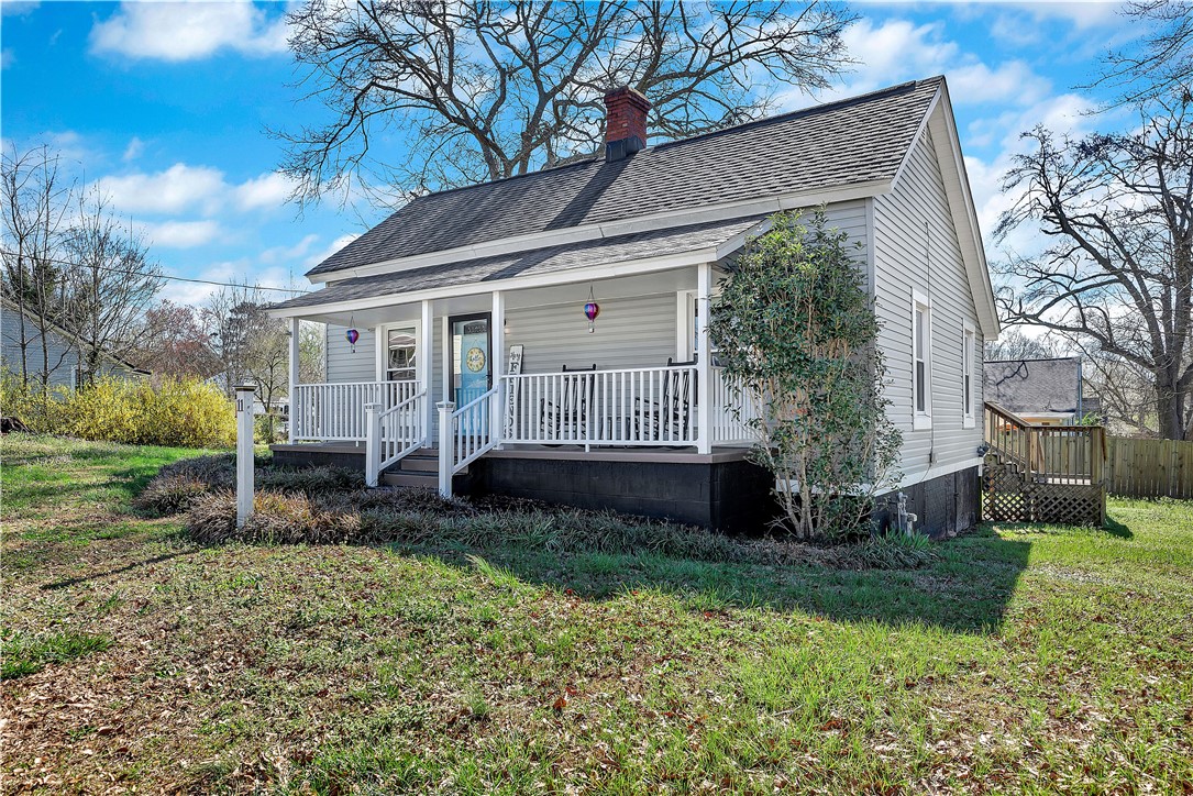 11 Jackson Street Liberty, SC 29657 - Photo 2 of 27 This charming home offers a welcoming facade with a covered porch and traditional siding.