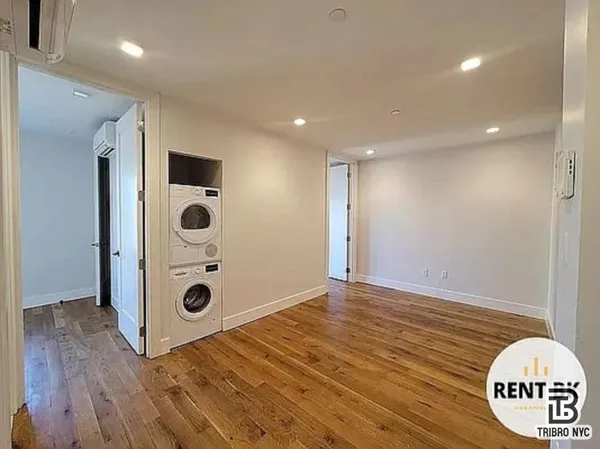 a view of a livingroom with wooden floor
