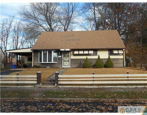 27 Caldwell Road Edison, NJ 08817 - Photo 1 of 3 a front view of a house with a yard